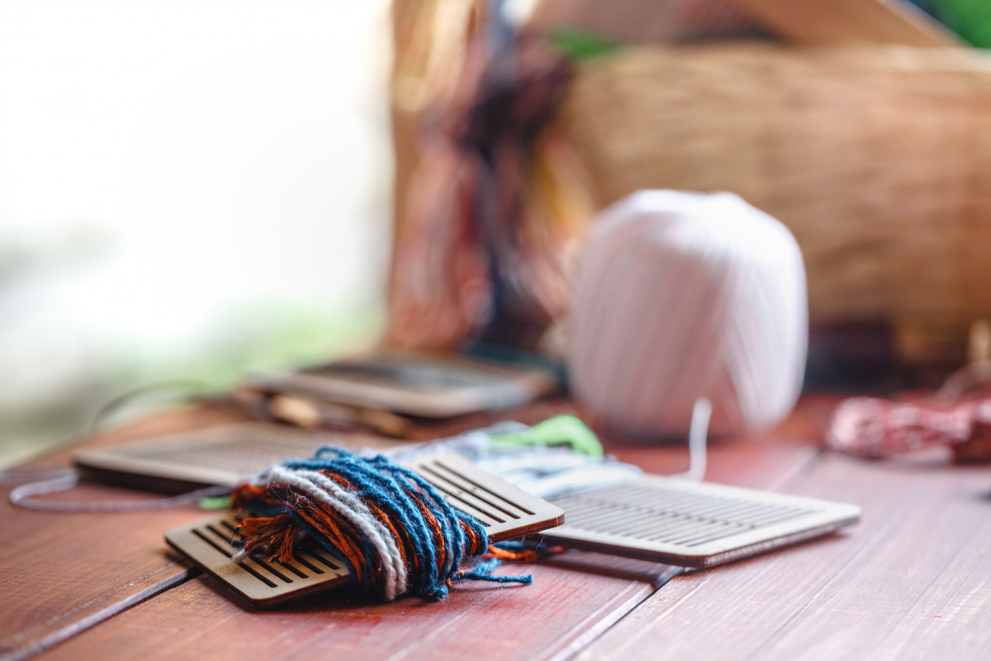 Student workspace with threads and hoop