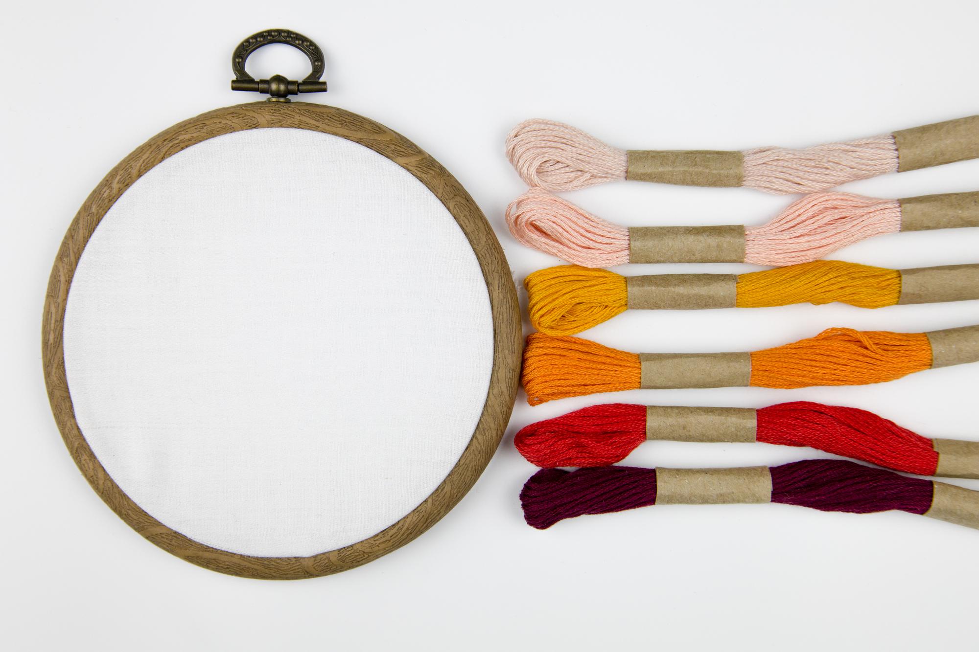 Close-up of hand-stitched embroidery on hoop